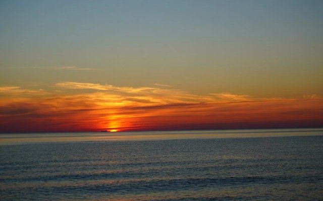 Sunrise over a calm lake